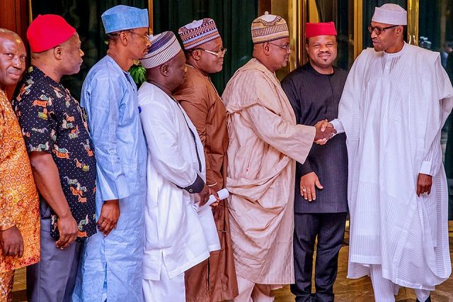 President Muhammadu Buhari, right, with the delegation from NUJ...