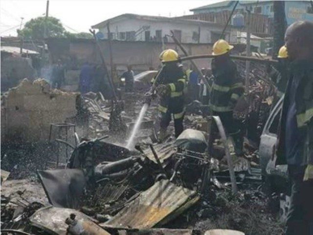 ...fire fighters in action at the scene of the Lagos gas explosion...