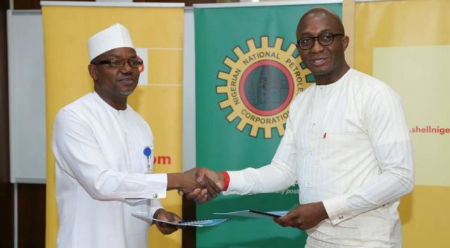 Director and General Manager, Business and Government Relations of The Shell Petroleum Development Company of Nigeria Limited, Bashir Bello (left) exchanging a signed $200 million Shell Contractor Support Fund Memorandum of Understanding with the General Manager Energy Bank of the United Bank for Africa, Ebele Ogbue in Abuja…