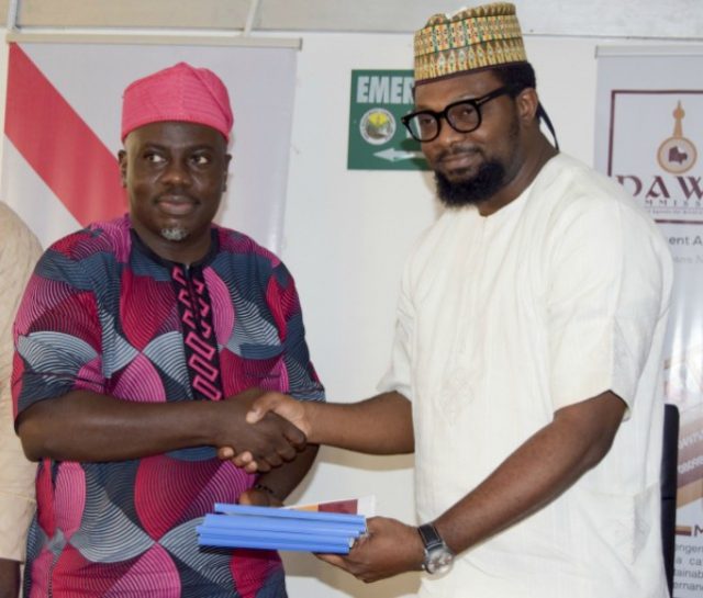 Mr Seye Oyeleye, the DG, Development Agenda for Western Nigeria (DAWN) Commission, left, with the rep of African Music Festival (AMFEST)...