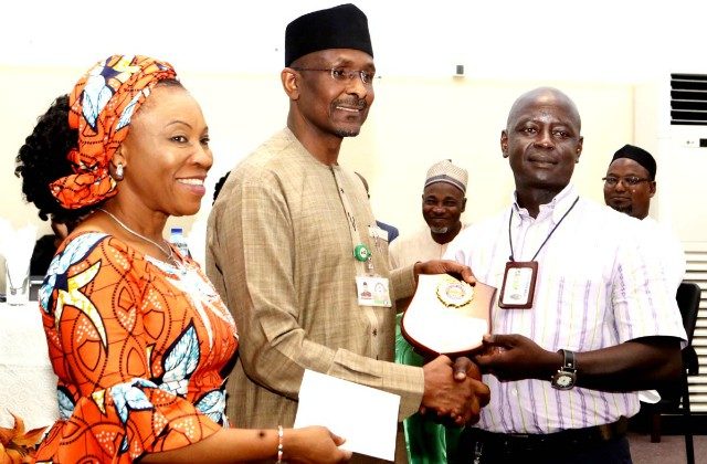 L-R: Mrs Nnenna Akajemeli, National Coordinator, SERVICOM, Mr Bashir Alkali, Director, Finance and Accounts, State House and Mr Yashim Nuhu, a Senior Motor Driver Mechanic, and State House Outstanding Driver Award recipient…