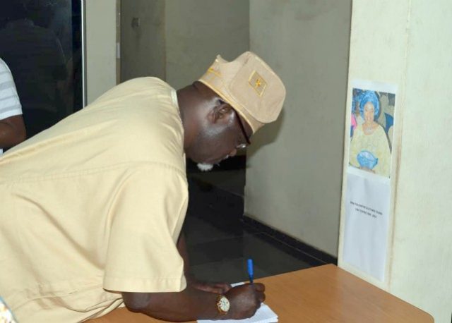 The Oyo State Commissioner for Information, Culture and Tourism, Mr. Toye Arulogun, signing the condolence register over the demise of the South West Zonal Director of National Broadcasting Commission, Mrs. 'Jumoke Olatunde Oginni during a visit to the NBC Zonal office in Ibadan