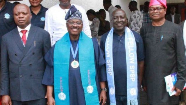 L-R: Vice Chancellor, University of Ibadan, Prof. Idowu Olayinka; Oyo State Governor, Senator Abiola Ajimobi; President, Society for Peace Studies and Practice, Dr Nathaniel Danjubo; and Chairman of the occasion, Prof. Adigun Agbaje, during a lecture delivered by the governor on 'Peace and security architecture for sustainable development in Oyo State,' and his investiture as Fellow of SPSP, at the University of Ibadan, Ibadan... on Thursday…