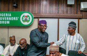 Colleagues Celebrate As Fayemi Becomes NGF’s Chairman ...Dr Kayode Fayemi, left, being congratulated by the governor of Oyo State, Senator Abiola Ajimobi...
