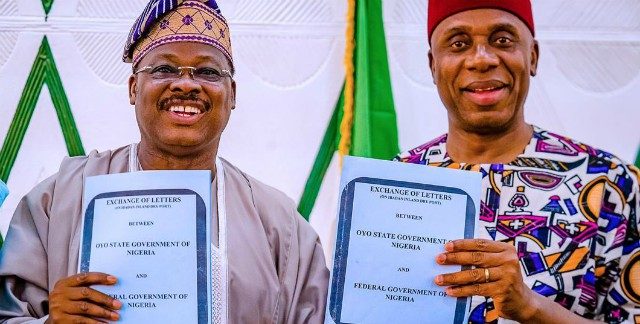 Oyo State Governor, Senator Abiola Ajimobi, left, with Minister of Transportation, Mr Rotimi Amaechi, during the signing of agreement on the proposed Ibadan Inland Dry Port…in Ibadan…