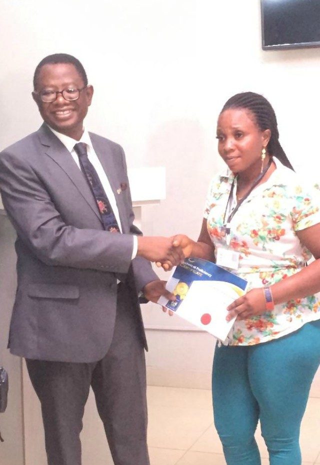 The Vice Chancellor of the First Technical University, Ibadan, Professor Ayobami Salami, left, giving out a certificate to one of the participants at the occasion...