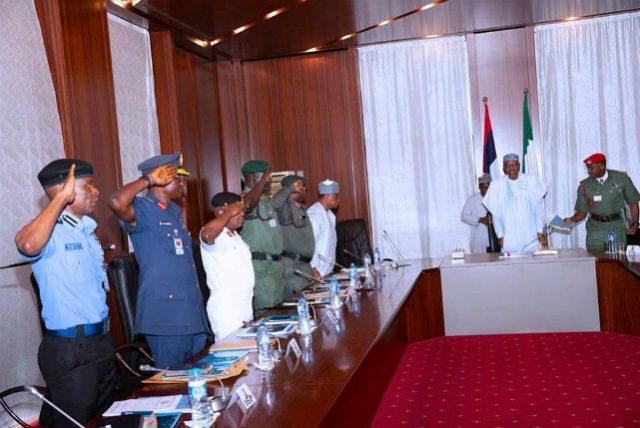 President Muhammadu Buhari with the security chiefs on Thursday in Abuja...