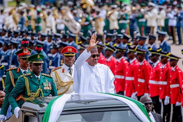 President Muhammadu Buhari...saluting fellow 'countrymen' at the event...
