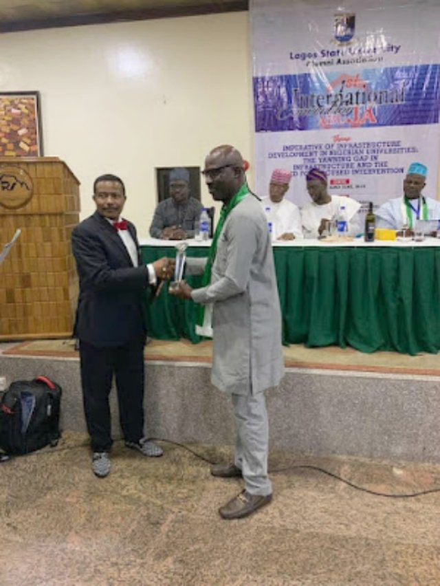 Ambassador Chris Kehinde Nwandu (CKN) being presented with his award by Maj Gen A T Jubril (rtd)…at the event…