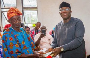 Photo: Fayemi Presents Cheques To Pensioners Ekiti State Governor, Dr Kayode Fayemi presenting a cheque to a retiree, Mr. Olowofela Francis…at the event…