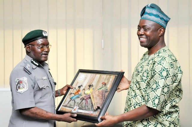Oyo State Governor, Engr Seyi Makinde (right) presenting a frame to Comptroller Abdullahi Zulkifli during the visit…