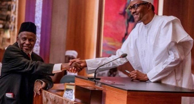 Mr Justice Ibrahim Tanko Mohammed, left, being congratulated by President Muhammadu Buhari...