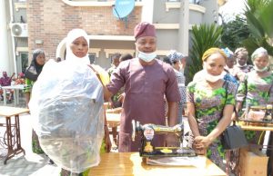 Oyo Lawmaker, Hon. Yusuf Adebisi Empowers 30 Constituents With Sewing Machines, Hair Dryers …Hon. Yusuf Adebisi with one of the beneficiaries shortly after the presentation…