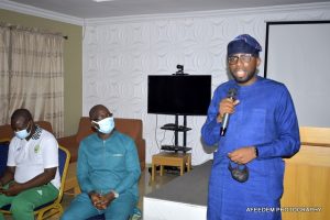 Hon Seyi Adisa right speaks while the Sports Minister and Engr Dotun Sanusi listen with rapt attention