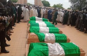 Burial Of Attahiru, Others: Two Women Slump, Gloom Covers Military Cemetery