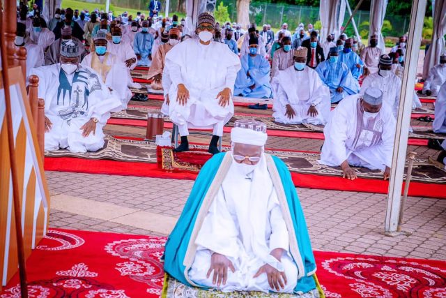 ...President Muhammadu Buhari...seated...during Eid-el-Fitri prayers within the State House on Thursday...