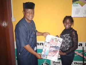 the crew leader at Parrot Xtra Media Network Olayinka Agboola left here presents a copy of one of our sister publications Parrot Xtra Magazine to the child movie star