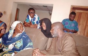 Photos: Muyiwa Ige, Others Attend Eighth Day Fidau For The Guardian’s Najeem Raheem ...Arc Muyiwa Ige, right, chatting with the widow of Raheem Najeem...while the children, Barakat and her brothers listen...
