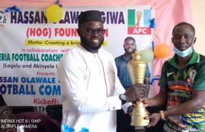 Hassan Giwa Foundation Football Competition Begins In Ibadan …presenting the trophy to the General Secretary, NFCA, Coach Akinwumi Isogun…