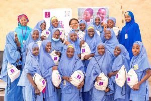 LR Halima Baba shehu Noella Ibeme and Hadiza Lawan Bukar with students of Government Girls College GGC Maiduguri posing with their kits