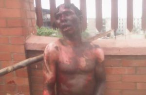 Suspected Kidnapper Who Pretends To Be Mad Nabbed, Mobbed By Ibadan Residents, See Images ...the suspect...being given a dose of jungle justice...