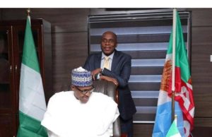 The Blood On Buhari, Amaechi’s Hands By Festus Adedayo ...President Muhammadu Buhari, seated, with Transportation Minister, Mr Rotimi Amaechi...in a rather symbolic pictorial setting...