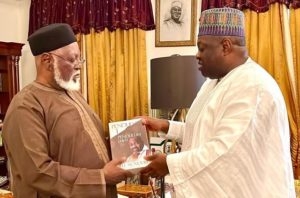Dele Momodu right presenting one of his books to General Abdusalami Abubakarin Minna on Sunday