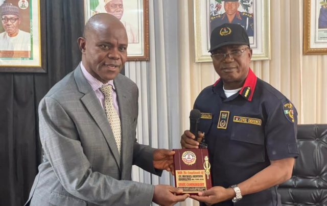 Mr. Adaralewa Micheal of Oyo NSCDC, right, with Mr Emmanuel Okoye of DSS...
