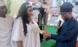 Governor Seyi Makinde's CPS, Mr Taiwo Adisa, right, presenting an award to Mrs Aduragbemi Animasahun-Euba (guber candidate of Young Democratic Party in Oyo State)...while Mr Tolu Adebayo, left, looks on...