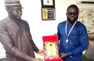 Hassan Giwa Honoured With Leadership Awards By Youth Organizations ...Arc Hassan Giwa, right, receiving one of his awards...