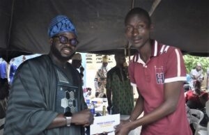 Philanthropist, Hassan Giwa Rewards 50 Teachers With Cash Arc (Chief) Hassan Giwa, left, with one of the recipients...at the event...