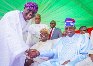 Lagos' Governor Babajide Sanwo-Olu, left, with Asiwaju Bola Tinubu...