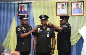 IPG Promotes 465 Officers As Osun, Others Get New CPs DIG Sanusi Nma Lemu...and another senior officer here decorate one of the newly promoted police officers...