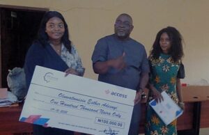Academic Excellence: Ibadan Poly Students Receive Monetary Reward From IPCentre Chairman IPCentre Otunba Abimbola Davis (middle) making a symbolic presentation to the two recipients...