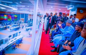 Dangote Refinery Will Positively Impact On Nigeria’s Economy – Buhari ...President Muhammadu Buhari and others listening to an expert as he discusses operational details of how Dangote Refinery will work...