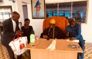 Day Olubadan Hailed Oyo Govt’s Initiative On Tomato Paste Production …Adekunle Aliu of New Age Tomatoes and Food Processing Company Nigeria Ltd presenting samples of the company's products to the Olubadan, Oba Lekan Balogun with Aremo Femi Balogun sitting next to him…