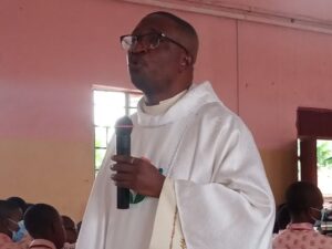 Reverend Dr Father Michael Domingodelivering his message