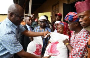 Excitement As Makinde Commences Distribution Of Food Relief Packages Engineer Seyi Makinde, left, personally distributing the food packages...in Oyo Town on Wednesday...