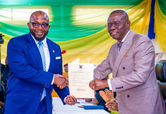 Sanwo-Olu and Olabode Agoro Newly appointed Head of Service, Mr Olabode Agor,left, being congratulated by Lagos State Governor, Mr Babajide Sanwo-Olu during his swearing in ceremony at the Banquet Hall, Lagos House, Alausa-Ikeja...