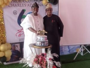 ...Prof Adesina with Olayinka Agboola of Parrot Xtra Media Network...