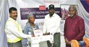 How Dangote Cement Successfully Empowered 305 Youths From Host Communities L-R, Dangote Cement Ibese, Acting Plant Director, Johnson Michael; One of the Beneficiaries receiving her certificate from the Ogun state Commissioner for Sports & Youths Development, Hon. Wasiu Adeniran Isiaka: and Dangote Cement Plc, Head of Social Performance, Wakeel Olayiwola, at the Closing ceremony of Dangote Cement Ibese Plant’s 2023 Skill Acquisition and Empowerment Program held at the Dangote Cement Ibese plant Ogun State…