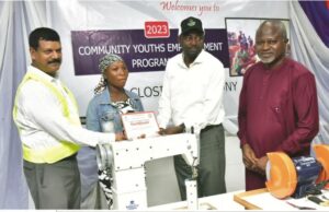 How Dangote Cement Successfully Empowered 305 Youths From Host Communities L-R, Dangote Cement Ibese, Acting Plant Director, Johnson Michael; One of the Beneficiaries receiving her certificate from the Ogun state Commissioner for Sports & Youths Development, Hon. Wasiu Adeniran Isiaka: and Dangote Cement Plc, Head of Social Performance, Wakeel Olayiwola, at the Closing ceremony of Dangote Cement Ibese Plant’s 2023 Skill Acquisition and Empowerment Program held at the Dangote Cement Ibese plant Ogun State…