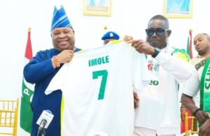 Day Super Eagles’ Supporters’ Club Secured Adeleke’s Backing Osun's Gov Ademola Adeleke, left, receiving his branded jersey from Prince Vincent Okumagba...