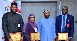 High Expectations As FIRS Unveils New Slogan, Inaugurates Customer Service Optimization Committee From right, winner of FIRS slogan challenge and staff of the agency from its Bauchi State office, Mohammed Gidado; FIRS chairman, Zacch Adedeji; first runner up, Shehu Hauwa Abubakar from Kaduna office of FIRS; and second runner up, Sanni Kabiru from Research and Statistics Department, during the unveiling of the new slogan at the Revenu House in Abuja, on Friday...