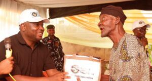 Thousands Uplifted As Tunmise Ayodele Foundation Lands In Ekiti Dr. Tunmise Ayodele, left, with a beneficiary...