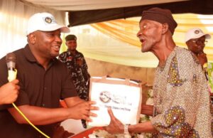 Thousands Uplifted As Tunmise Ayodele Foundation Lands In Ekiti Dr. Tunmise Ayodele, left, with a beneficiary...