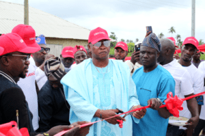 L R Chief SB Olukolu Patron of Oriba Youth Movement commissioning flaked around by his aids and staff of LG Electronics Mr Paul Mba Marketing Manager LG Electronics Nigeria at the official commissioning of the solar powered borehole and streetlights donated to Oriba Community area of Epe Lagos State