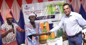 Farmers In Host Communities Receive Agricultural Inputs From Dangote Cement L–R: Ademola Ojolowo, Head of Social Performance, Dangote Cement Plc, Ibese plant; Elder Simon Oyewole, One of the farmer beneficiaries and Roy Uttam, Plant Director, Dangote Cement Plc Ibese plant, congratulating the beneficiary during the Agric Inputs presentation at Dangote Cement Plc Ibese plant, at the 2024 Farmers Empowerment Programme held at Ibese, Ogun state...