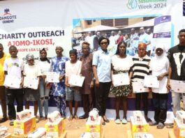 …Beneficiaries of the Dangote Cement Sustainability Team displaying their Skills acquisition scholarship certificates at the Ajomo-Ikosi community in Kosofe Local Government during the 2024 Sustainability Week celebrations in Lagos…