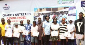 Dangote Cement Commits To Carbon Emission Reduction For Business Optimisation …Beneficiaries of the Dangote Cement Sustainability Team displaying their Skills acquisition scholarship certificates at the Ajomo-Ikosi community in Kosofe Local Government during the 2024 Sustainability Week celebrations in Lagos…